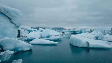 Aerial over icebergs floating in Jokulsarlon Lagoon by the southern coast of Iceland