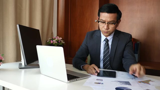 Businessman doing analysis planning business project in office.