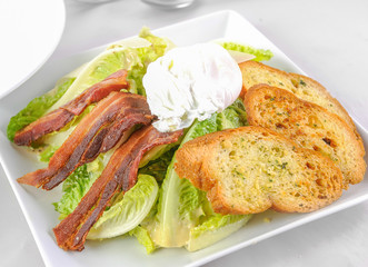 Ceasar salad with egg and bacon