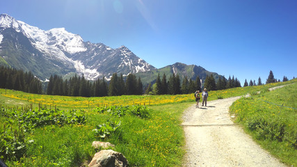 POV from Old fashioned Montblanc tramway to two hikkers. Nid d’Aigle the is last station Mont...