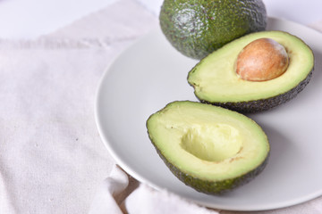 Ripe avocado on a plate.