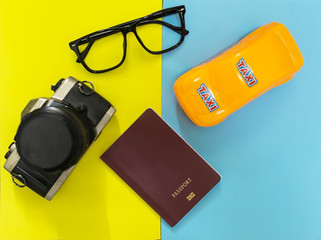 toy car taxi with  passport and old retro camera,Travel planning concept