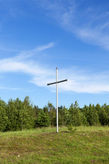 metal cross in the wood