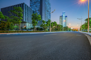 Fototapeta na wymiar clean asphalt road through office block area, suzhou, china.