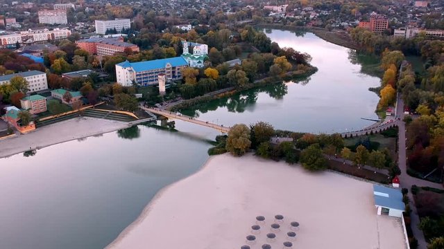 Aerial view on Mirgorod city, Ukraine. Old video style, low light evening sunset autumn footage