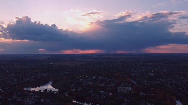 Aerial view on Mirgorod city, Ukraine. Old video style, low light evening sunset autumn footage