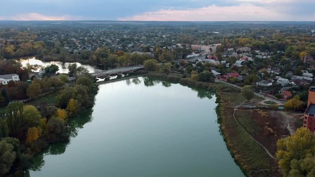 Aerial view on Mirgorod city, Ukraine. Old video style, low light evening sunset autumn footage