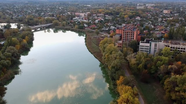 Aerial view on Mirgorod city, Ukraine. Old video style, low light evening sunset autumn footage