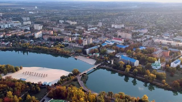 Aerial view on Mirgorod city, Ukraine. Old video style, low light evening sunset autumn footage