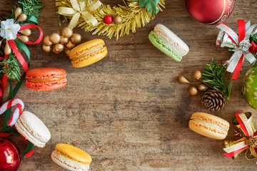 Beautiful and cute macaron in top view flat lay with Christmas background. Homemade delicious...