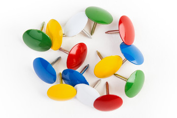 collection of colored pins on a white background