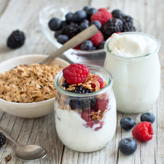 Breakfast with Fresh greek yogurt, muesli and berries