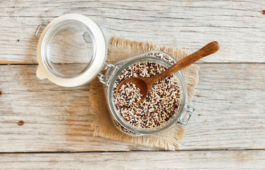 Uncooked mixed quinoa grain in a glass