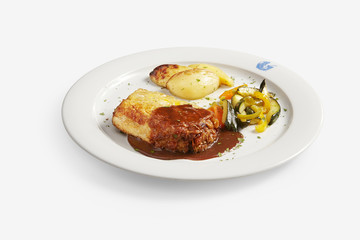 Exihiko lamb with brown sauce and roast potator, courgette and red, yellow and green pepper