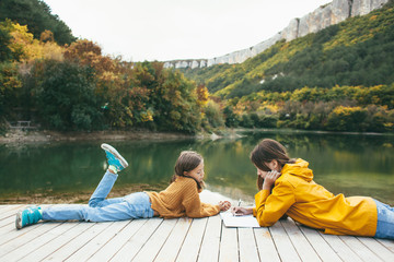 Children spending time by the lake