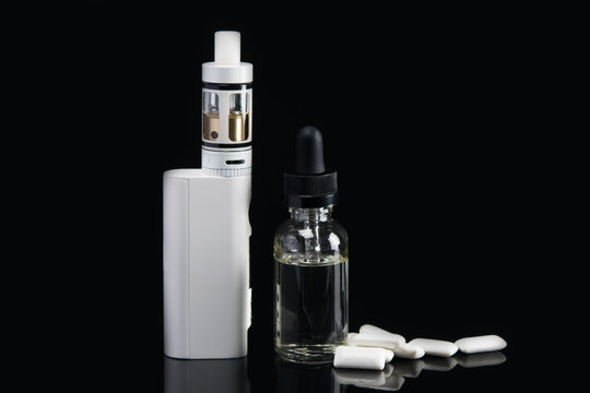 electronic cigarette with dressing for her, flavor of chewing gum on a black background, with a hatching