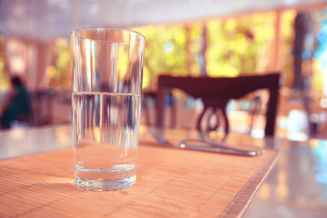 A glass of water on a table restaurant