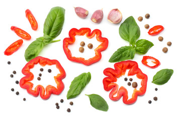 mix of slice of tomato, basil leaf, garlic, sweet bell pepper and spices isolated on white background. top view