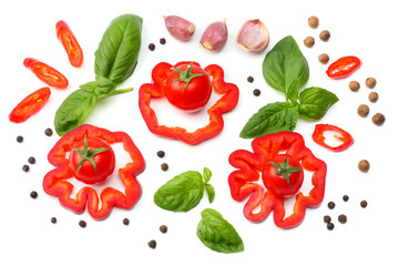 mix of slice of tomato, basil leaf, garlic, sweet bell pepper and spices isolated on white background. top view