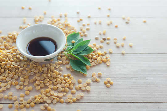 soy sauce in cup with soy bean side view