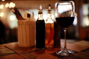 Serving a glass of red wine in a restaurant