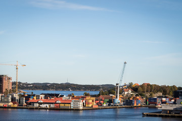 Fototapeta na wymiar The containers in the port of Kristiansand, sun and blue sky
