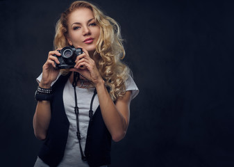 Female photographer taking pictures with a compact camera.