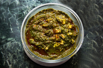 Indian Curry dish Palak Paneer served in a Microsafe Glass bowl