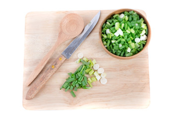 Chopped fresh green onions isolated on white background. Top view