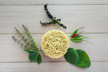 instant noodles raw with chili peppers and basil