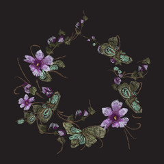 Embroidery floral  vintage pattern with ethnic violets. Vector embroidered wreath with flowers for wearing design.