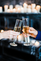 bride and groom holding glasses with champaign