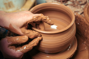 Potter at work. Workshop.