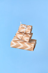 Woman's hands trying to catch gift box. Christmas or new year decorated gift box.