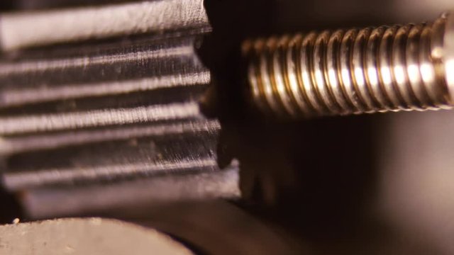 Cogwheel system of the self timer of a vintage camera - macro shot in 4K
