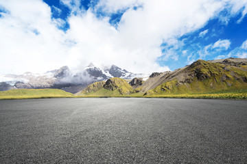 empty asphalt road with beautiful snow mountain