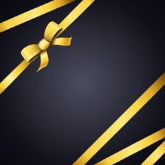 Gold ribbon on black background with copy space