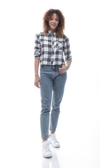 stylish young woman in plaid shirt and jeans.