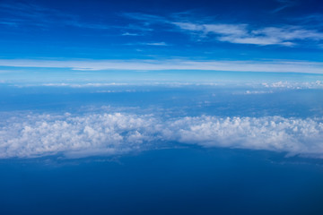Naklejka na ściany i meble Cloud texture and blue sky view from airplane.