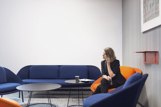 Architect phoning in office