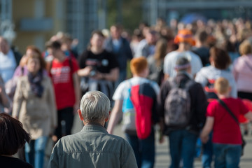 Crowd of people on the street. No recognizable faces