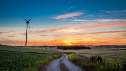 Stunning dusk with wind turbines as alternative energy