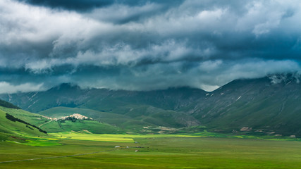 Dramatic sky and valley in Castelluccio at summer, Umbria, Italy
