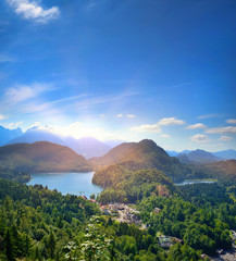 Beautiful view of the alpine lake Alpsee. Sunny summer day in the mountains