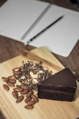 Cake chocolate on wooden table background., at time relaxing.