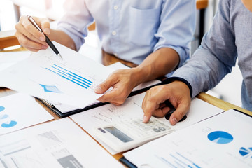 Administrator business man financial inspector and secretary making report, calculating balance. Internal Revenue Service checking document. Audit concept.