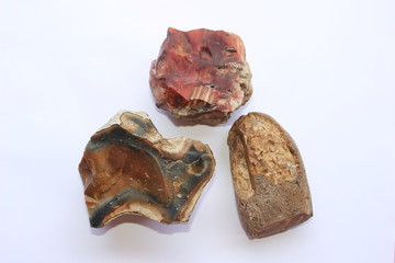 Three flintstones on a white background