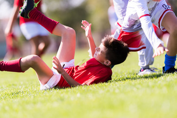 Obraz premium Kids soccer football - young children players match on soccer field