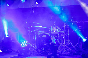 Fototapeta na wymiar cymbals set in blue light of searchlights