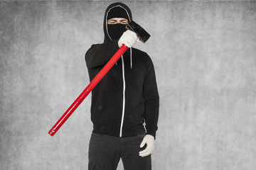 A masked stranger shows an action tool